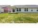 Lush backyard showcasing a covered patio and the home's exterior at 745 Stone Trace Ct, Avon, IN 46123
