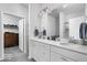 Bathroom with double vanity, white cabinets and tiled shower at 745 Stone Trace Ct, Avon, IN 46123
