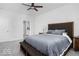 Bedroom featuring a queen bed, grey carpet and ensuite bathroom at 745 Stone Trace Ct, Avon, IN 46123