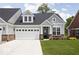 Charming home with a two-car garage and well-manicured lawn at 745 Stone Trace Ct, Avon, IN 46123