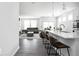 Spacious kitchen with modern appliances and adjacent open-concept living room at 745 Stone Trace Ct, Avon, IN 46123