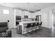 Modern kitchen featuring white cabinets, stainless steel appliances, and island seating at 745 Stone Trace Ct, Avon, IN 46123
