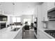 Modern kitchen open to the living room with stainless steel appliances at 745 Stone Trace Ct, Avon, IN 46123