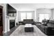 Bright living room with fireplace, large windows, and plush seating area at 745 Stone Trace Ct, Avon, IN 46123