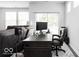 Home office with desk, chair, and computer near the living room at 745 Stone Trace Ct, Avon, IN 46123