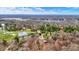 Expansive aerial view of a beautiful lakeside community with lush trees and clear blue skies on a sunny day at 7469 Lion Dr, Nineveh, IN 46164