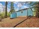 A blue shed sits in the backyard next to the home at 7469 Lion Dr, Nineveh, IN 46164