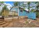 The wooden deck is featured in the backyard, next to the shed at 7469 Lion Dr, Nineveh, IN 46164