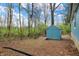 An outdoor shed sits in the backyard with a sky blue sky at 7469 Lion Dr, Nineveh, IN 46164