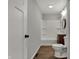 Bathroom with new floors, vanity, lighting and toilet at 7469 Lion Dr, Nineveh, IN 46164