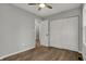 Bedroom includes plank floors, ceiling fan, and closet at 7469 Lion Dr, Nineveh, IN 46164
