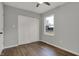 Bedroom with plank flooring, ceiling fan, closet, and window at 7469 Lion Dr, Nineveh, IN 46164