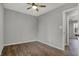 Bedroom featuring plank flooring, ceiling fan, closet, and doorway at 7469 Lion Dr, Nineveh, IN 46164