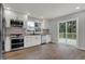 Bright kitchen features stainless appliances, white cabinets, butcher block counters, and sliding doors to the new deck at 7469 Lion Dr, Nineveh, IN 46164