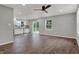 Bright and airy living room featuring hardwood floors, recessed lighting, and a ceiling fan, showcasing an open layout at 7469 Lion Dr, Nineveh, IN 46164