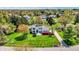 Aerial view of a stunning modern home with lush landscaping, surrounded by mature trees in a desirable neighborhood at 7531 Normandy Blvd, Indianapolis, IN 46278