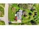 Aerial view of a property with a well-manicured lawn, a gray roof, and colorful landscaping at 7531 Normandy Blvd, Indianapolis, IN 46278