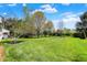Expansive backyard featuring a sprawling lawn and mature trees, providing a tranquil and private outdoor space at 7531 Normandy Blvd, Indianapolis, IN 46278