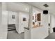 Basement with stairs, door, and built-in counter with a view into another room at 7531 Normandy Blvd, Indianapolis, IN 46278