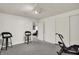 Basement exercise area featuring workout equipment and bar stools at 7531 Normandy Blvd, Indianapolis, IN 46278