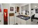 Basement bar area with counter, wine rack, mini fridge, and workout equipment in the background at 7531 Normandy Blvd, Indianapolis, IN 46278