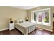 Bedroom showcasing a queen bed flanked by matching nightstands and large window at 7531 Normandy Blvd, Indianapolis, IN 46278