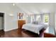 Bright bedroom with hardwood floors, high ceilings, and three large windows at 7531 Normandy Blvd, Indianapolis, IN 46278