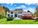 Stunning two-story home with manicured lawn, vibrant landscaping, and a grand entryway at 7531 Normandy Blvd, Indianapolis, IN 46278