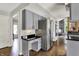 Bright kitchen featuring stainless steel appliances, gray cabinets and a contrasting black countertop at 7531 Normandy Blvd, Indianapolis, IN 46278