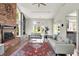 Bright, vaulted living room with fireplace and a connected kitchen area at 7531 Normandy Blvd, Indianapolis, IN 46278