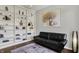 Stylish living room featuring a black couch, built-in shelving, and elegant decor at 7531 Normandy Blvd, Indianapolis, IN 46278