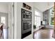 Modern ovens on the wall next to the living room with built-in shelving at 7531 Normandy Blvd, Indianapolis, IN 46278