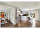 Open floorplan with hardwood floors seamlessly connecting the kitchen and dining areas at 7531 Normandy Blvd, Indianapolis, IN 46278