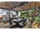 Charming outdoor patio with stylish seating under a pergola, perfect for entertaining and enjoying the lush backyard at 7531 Normandy Blvd, Indianapolis, IN 46278