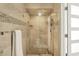Modern walk-in shower with glass door, tiled walls, and rainfall shower head at 7531 Normandy Blvd, Indianapolis, IN 46278