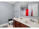Bathroom with double sinks, a large mirror, and a red shower curtain at 805 Harvest Lake Dr, Brownsburg, IN 46112