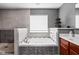 Elegant bathroom features a soaking tub with tile surround, separate shower, and modern fixtures at 805 Harvest Lake Dr, Brownsburg, IN 46112