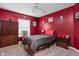 Bright bedroom features a ceiling fan, large window, and colorful decor at 805 Harvest Lake Dr, Brownsburg, IN 46112