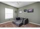 Bedroom with neutral colors, a modular gray couch, and a bright window at 805 Harvest Lake Dr, Brownsburg, IN 46112