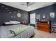 The bedroom features unique Star Wars themed wall decor and a ceiling fan at 805 Harvest Lake Dr, Brownsburg, IN 46112