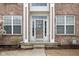 Welcoming front entrance with decorative door, sidelights, and well-kept landscaping at 805 Harvest Lake Dr, Brownsburg, IN 46112