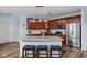 Lovely kitchen with a spacious island with bar stool seating and stainless steel appliances at 805 Harvest Lake Dr, Brownsburg, IN 46112