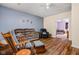 Cozy living room featuring hardwood floors, ceiling fan, and easy access to the bedroom at 805 Harvest Lake Dr, Brownsburg, IN 46112