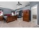 Spacious main bedroom with vaulted ceiling, a leather recliner, and an attached bathroom at 805 Harvest Lake Dr, Brownsburg, IN 46112