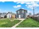 Spacious backyard with a concrete patio, fire pit, and lush green lawn perfect for outdoor enjoyment at 827 E Minnesota St, Indianapolis, IN 46203
