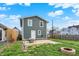 Spacious backyard with a concrete patio, fire pit, and lush green lawn perfect for outdoor enjoyment at 827 E Minnesota St, Indianapolis, IN 46203