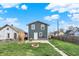 Spacious backyard with a concrete patio, fire pit, and lush green lawn perfect for outdoor enjoyment at 827 E Minnesota St, Indianapolis, IN 46203
