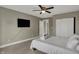 Comfortable bedroom featuring a ceiling fan, closet and soft carpeted floor at 827 E Minnesota St, Indianapolis, IN 46203
