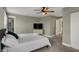 Comfortable bedroom includes a ceiling fan, dresser with tv, and closet at 827 E Minnesota St, Indianapolis, IN 46203