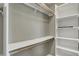 Walk-in closet features custom shelving, providing ample storage space at 827 E Minnesota St, Indianapolis, IN 46203